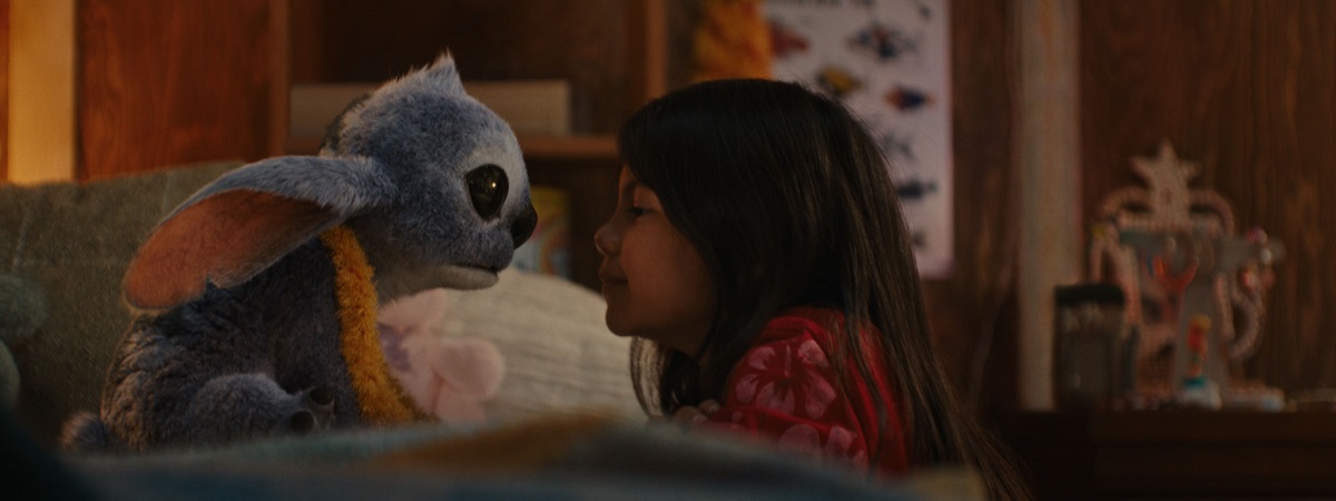 (L-R) Stitch and Maia Kealoha as Lilo in Disney’s Lilo & Stitch.