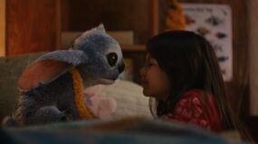 (L-R) Stitch and Maia Kealoha as Lilo in Disney’s Lilo & Stitch.