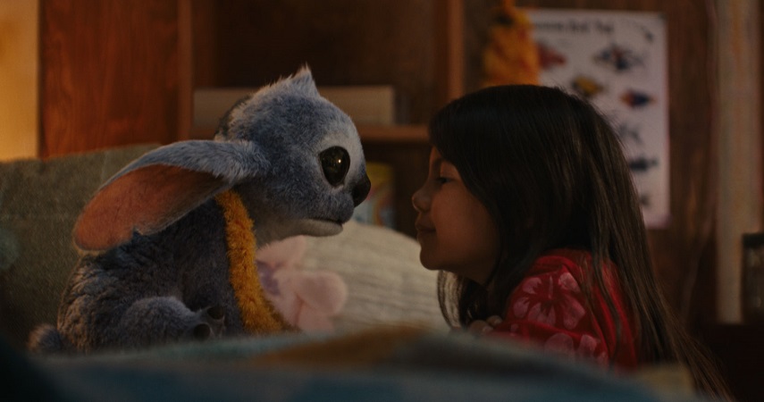 (L-R) Stitch and Maia Kealoha as Lilo in Disney’s Lilo & Stitch.